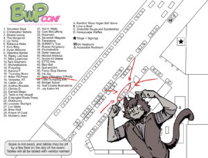 Map of the BWPcon layout with their catboy mascot pointing at my table.